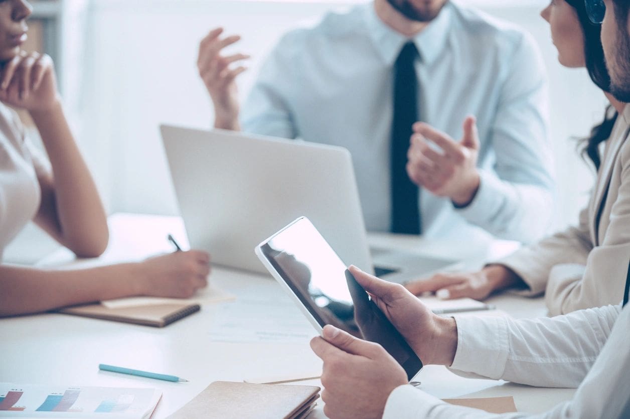 A picture of professionals in a meeting room for rent.